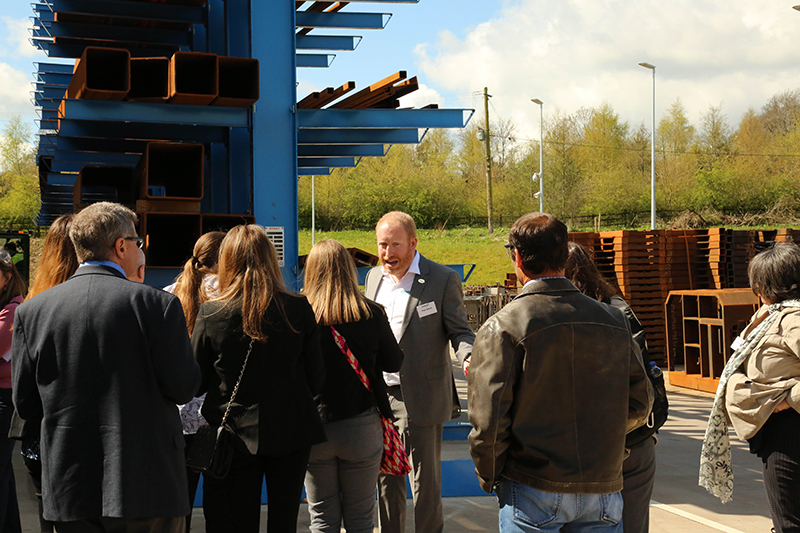 Combilift North American Sales President Paul Short discusses a product demonstration with North American journalists. (Combilift photo)