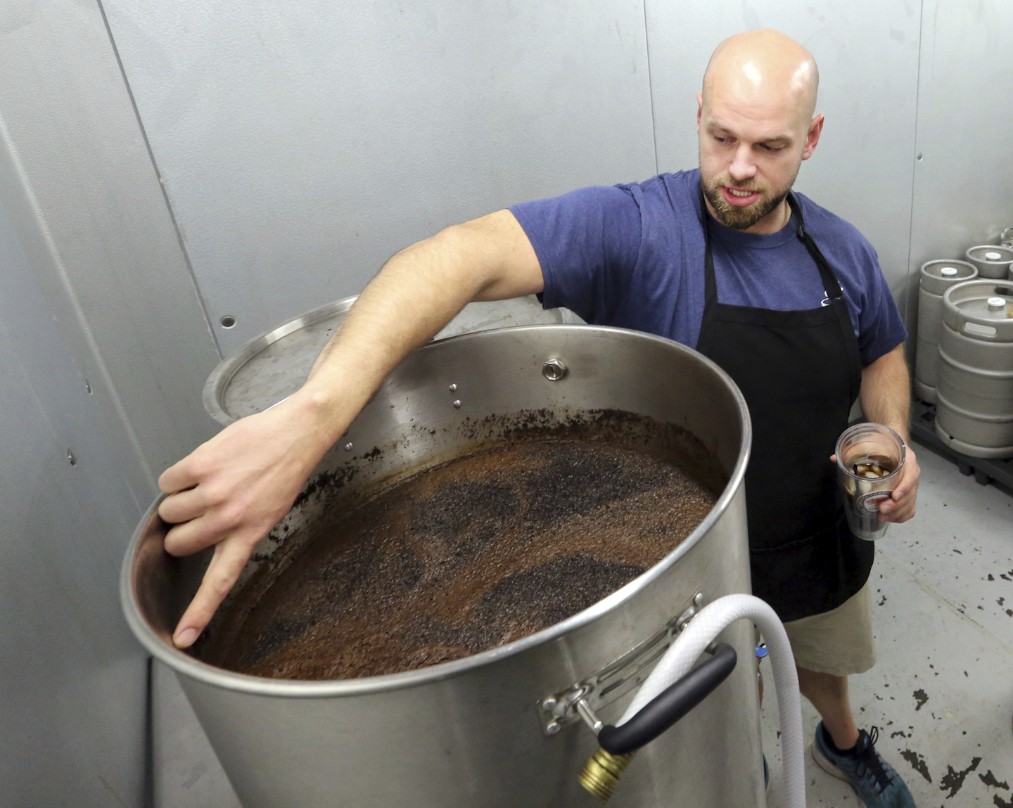 Seen in this 2017 photo, Drew Wynne who quit his job in 2016 to pursue a career manufacturing cold-brew coffee died in October 2017 after using a paint stripper at the business in Charleston, S.C. EPA administrator Scott Pruitt had put on hold the Obama administration’s attempt to ban consumer sales of paint strippers containing the compound methylene chloride. But he reversed course in May after meeting with families of men who died after using paint stripper. Brian Wynne, brother of Drew, believes, methylene chloride may already have been out of stores by fall 2017, when his brother was found dead at the business, killed by methylene chloride, according to coroners. (Brad Nettles/The Post and Courier via AP)