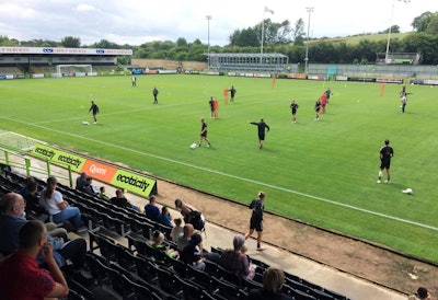 In this Monday, July 30, 2018 photo, players training at The New Lawn, Forest Green Rovers’ football ground, in Nailsworth, England. An English soccer club has become the first professional sports team in the world to be certified as carbon neutral by the United Nations. (AP Photo/James Brooks)