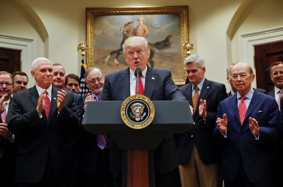 President Donald Trump speaks in the Roosevelt Room of the White House in Washington, Friday, April 28, 2017, before signing an Executive Order directing the Interior Department to begin review of restrictive drilling policies for the outer-continental shelf. From left are, Vice President Mike Pence, Rep. Don Young, R-Alaska, the president, Sen. Bill Cassidy, R-La., and Commerce Secretary Wilbur Ross. (AP Photo/Pablo Martinez Monsivais)