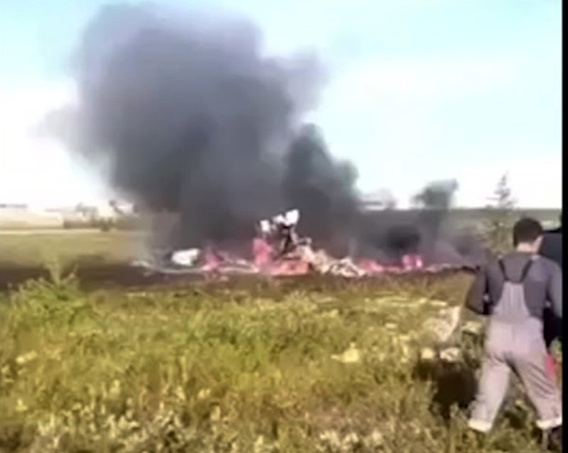 In this image made from a Russian Emergency Situations Ministry video, a smoke rises from a crash side of a Russian helicopter Mi-8 crashed shortly after takeoff in Vankor, above the Arctic Circle in Siberia, Russia, Saturday, Aug. 4, 2018. A Russian helicopter crashed shortly after takeoff in Siberia on Saturday, killing all 18 people aboard. The Interstate Aviation Committee, which oversees civil aviation in much of the former Soviet Union, said the Mi-8 helicopter collided with the load being carried by another helicopter that had taken off from the same pad in Vankor, above the Arctic Circle about 2,600 kilometers (1600 miles) northeast of Moscow. The second helicopter was undamaged and landed safely, the committee said. (Russian Ministry for Emergency Situations photo via AP)