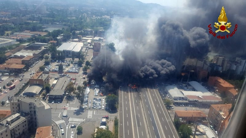 In this photo released by the Italian firefighters, an helicopter view of the explosion on a highway in the outskirts of Bologna, Italy, Monday, Aug. 6, 2018. The explosion was reportedly caused by an accident involving a truck that was transporting flammable substances and exploded upon impact. (Vigili Del Fuoco via AP)