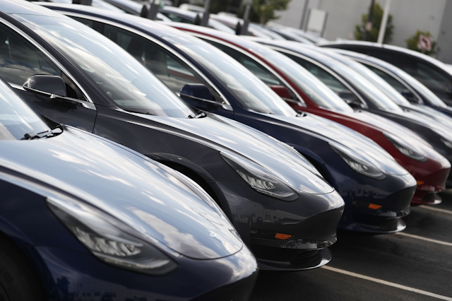 In this Sunday, July 8, 2018, photograph, 2018 Model 3 sedans sit on display outside a Tesla showroom in Littleton, Colo. Image credit: AP Photo/David Zalubowski