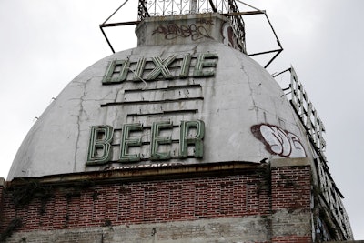 This Wednesday, July 3, 2013 file photo shows the top of the abandoned Dixie Beer brewery on Tulane Avenue in New Orleans. Image credit: AP Photo/Gerald Herbert