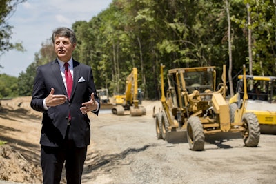 In this July 25, 2018, photo, Stephen Bell, president and CEO of the Arkadelphia Area Chamber of Commerce, talks about a new railroad spur that is being built to support the needs of what he hopes will be a new paper mill, one of several Chinese-backed deals Arkansas has landed in recent years, in Arkadelphia, Ark. Image credit:AP Photo/Karen E. Segrave