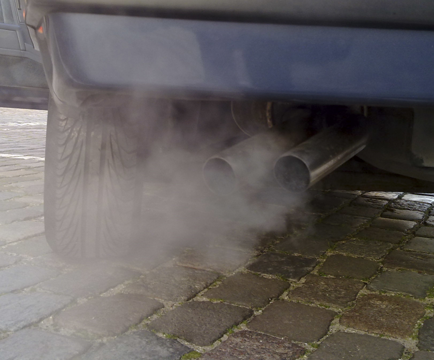 Automobile exhaust gas. White exhaust gas is mostly water vapor. Black smoke could come from oil burning. (Wikimedia)