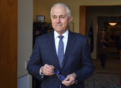 Australia's Prime Minister Malcolm Turnbull arrives for a meeting with Poland's President Andrzej Duda at Parliament House in Canberra, Monday, Aug. 20, 2018. Turnbull abandoned plans to legislate to limit greenhouse gas emissions to head off a revolt by conservative lawmakers. (Mick Tsikas/Pool Photo via AP)