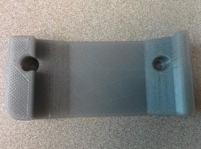 With 3D-printers, soldiers could soon use recycled bottles and other waste materials to make vital parts, such as this vehicle radio bracket. (Nicole Zander/U.S. Army Research Laboratory)