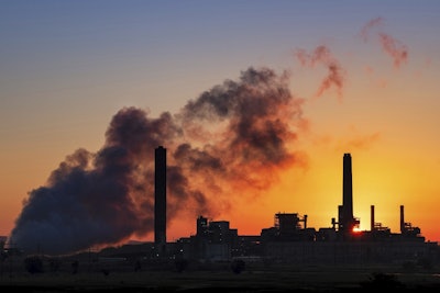 In this July 27, 2018 photo, the Dave Johnson coal-fired power plant is silhouetted against the morning sun in Glenrock, Wyo. Image credit: AP Photo/J. David Ake