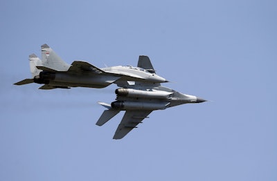 Serbian Army MiG-29 jet fighters fly over Batajnica, military airport near Belgrade, Serbia, Tuesday, Aug. 21, 2018. Image credit: AP Photo/Darko Vojinovic