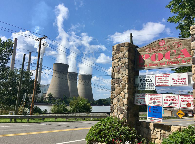 In this Aug. 23, 2018 photo, American Electric Power’s John Amos coal-fired plant in Winfield, W.Va., is seen from the town of Poca across the Kanawha River. President Donald Trump picked West Virginia where he announced rolling back pollution rules for coal-fired power plants. But he didn’t mention that the northern two-thirds of West Virginia, with the neighboring part of Pennsylvania, would be hit hardest. (AP Photo/John Raby)