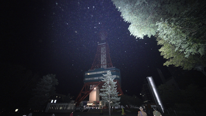 In this Thursday, Sept. 6, 2018, file photo, a man calls with a public phone in the blackout on the center of Sapporo city, Hokkaido, northern Japan, after a powerful earthquake. Image credit: AP Photo/Eugene Hoshiko, File