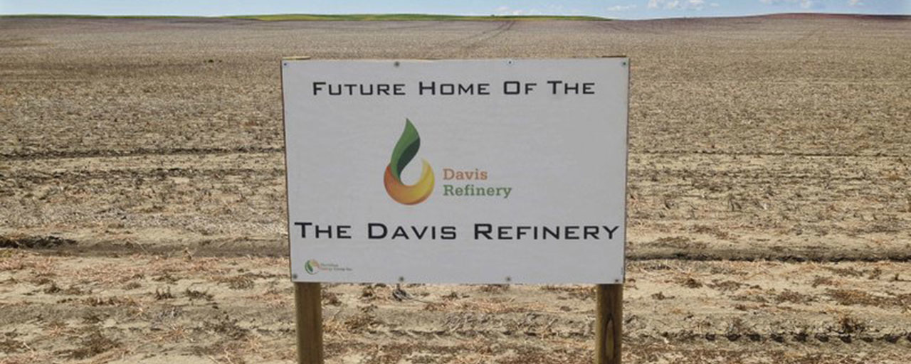 This July 19, 2018, file photo, shows a sign on property near southwest Belfield, N.D, for the proposedfuture home of the Davis Refinery near Theodore Roosevelt National Park. North Dakota regulators are enlisting an administrative law judge to help untangle some of the legal questions surrounding whether an oil refinery can be built near the park. Meridian Energy Group plans to build the refinery 3 miles from the park. Two environmental groups maintain that Meridian needs state approval for the site. Meridian disputes that. (Tom Stromme/The Bismarck Tribune via AP)