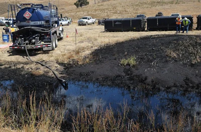 In this May 20, 2015, file photo, clean-up workers monitor the site of an underground oil pipeline break near Refugio State Beach, north of Goleta, Calif. The 24-inch pipeline, owned by Plains All American Pipeline, spewed oil down a storm drain and into the Pacific for several hours before it was shut off. A California jury has found the pipeline company guilty of nine criminal charges for causing a 2015 oil spill that was the state's worst coastal spill in 25 years. The jury reached its verdict against Plains All American Pipeline of Houston on Friday, Sept. 7, 2018, following a four-month trial. (AP Photo/Michael A. Mariant)