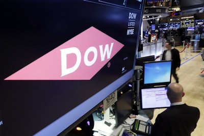 In this Dec. 9, 2015, file photo, the company name of Dow appears above its trading post on the floor of the New York Stock Exchange. DowDuPont names James C. Collins Jr. as CEO of Corteva Agriscience, which is what the agriculture unit will be called once spun off. Marc Doyle will become CEO of DuPont, which is what the specialty products division will be named once separated. (AP Photo/Richard Drew)