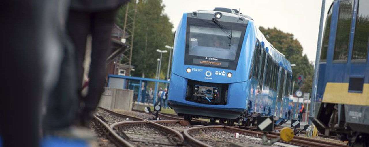 In this Sept. 16, 2018 photo a fuel cell train which is powered by hydrogen arrives in Bremervoerde, northern Germany. It is one of two trains that will go into regular service in 2019. (Philipp Schulze/dpa via AP)