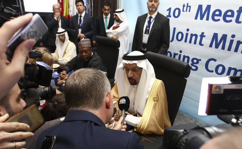 Khalid Al-Falih, Minister of Energy, Industry and Mineral Resources of Saudi Arabia speaks to journalists during OPEC's 10th meeting of the Joint Ministerial Committee to monitor the oil production reduction agreement of the Organization of the Petroleum Exporting Countries, OPEC, and non-OPEC members, in Algiers, Algeria, Sunday, Sept. 23, 2018. (AP Photo/Anis Belghoul)