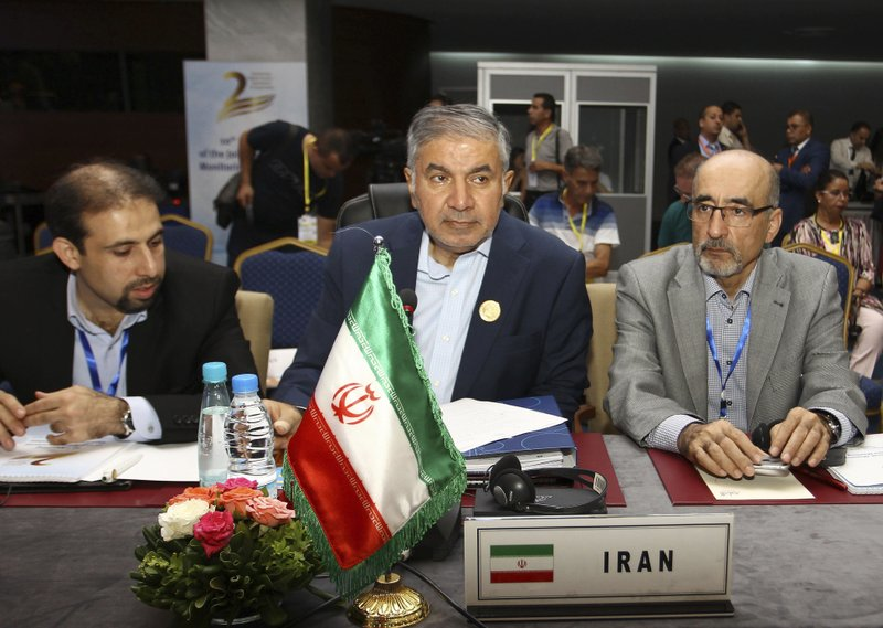 Iran's Organization of the Petroleum Exporting Countries (OPEC) governor Hossein Kazempour Ardebili, centre, attends OPEC's 10th meeting of the Joint Ministerial Committee to monitor the oil production reduction agreement of the Organization of the Petroleum Exporting Countries, OPEC, and non-OPEC members, in Algiers, Algeria, Sunday, Sept. 23, 2018. The meeting of OPEC and its allies ended Sunday without any decision to further increase oil output, despite President Donald Trump's call for lower prices. (AP Photo/Anis Belghoul)