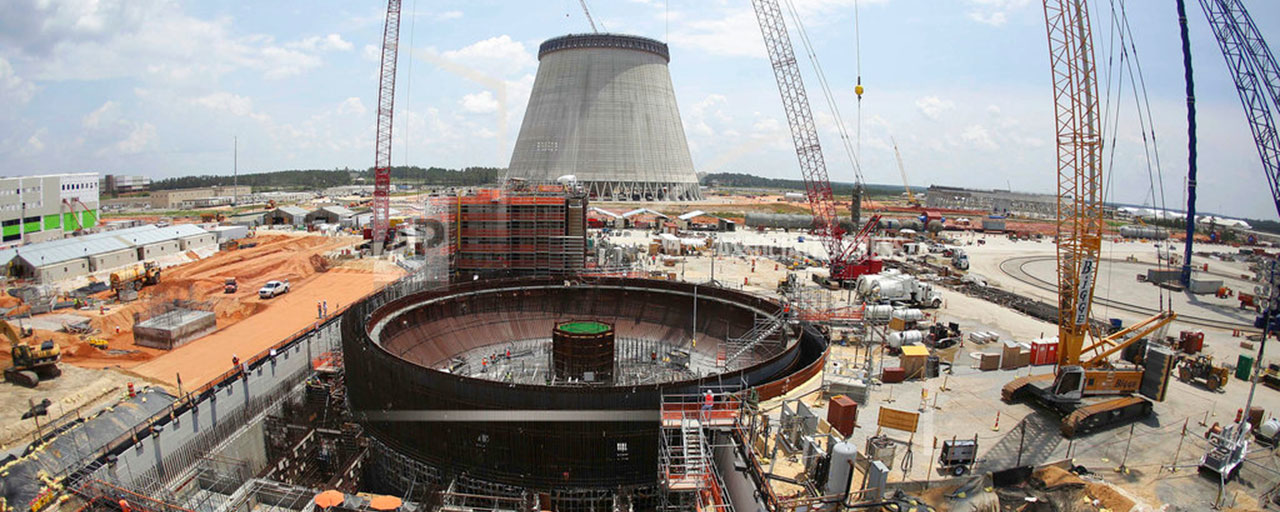 This June 13, 2014, file photo, shows construction on a new nuclear reactor at Plant Vogtle power plant in Waynesboro, Ga. A group of Georgia lawmakers wants a “cost cap” in the construction of a nuclear power plant near Augusta to protect blown budgets from being passed on to consumers. Two reactors being built at Plant Vogtle are billions of dollars over budget. (AP Photo/John Bazemore, File)