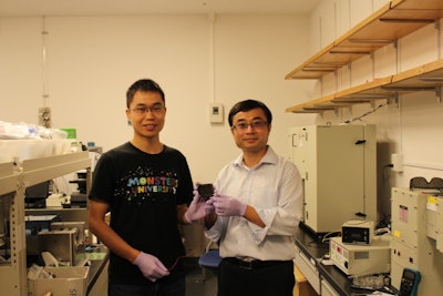 Dr. Zonghao Liu (left) and Professor Yabing Qi (right) with the 5 cm × 5 cm perovskite solar module that they developed in their lab at OIST. (OIST)