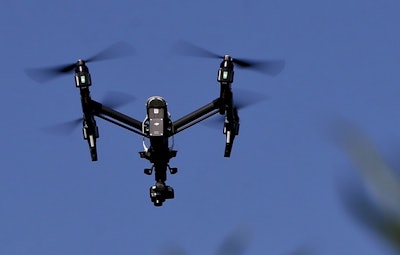 In this July 11, 2018 file photo, s drone equipped with a thermal camera flies over the plants at the Pennsylvania Department of Natural Resources' Jennings Environmental Education Center on Wednesday, July 11, 2018 in Slippery Rock, Pa. Image credit: AP Photo/Keith Srakocic, File