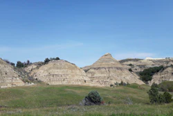 This Aug. 1, 2018, file photo, shows a view of the badlands landscape at Theodore Roosevelt National Park near Medora, N.D. Image credit: AP Photo/Steve Karnowski, File