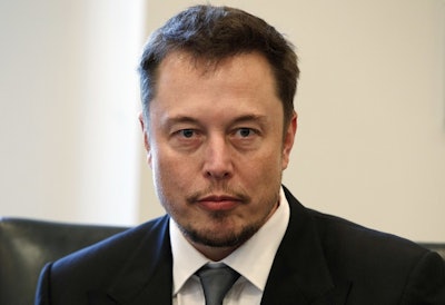 In this Dec. 14, 2016, file photo, Tesla CEO Elon Musk listens as President-elect Donald Trump speaks during a meeting with technology industry leaders at Trump Tower in New York. Image credit: AP Photo/Evan Vucci, File