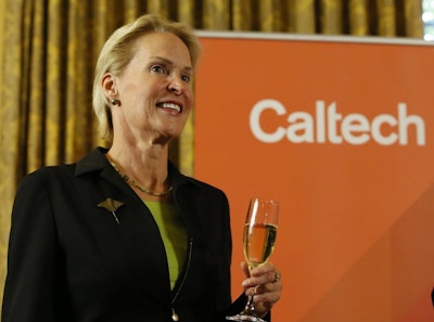 Nobel chemistry winner Frances Arnold makes a toast at California Institute of Technology in Pasadena, Calif., Wednesday, Oct. 3, 2018. (AP Photo/Damian Dovarganes)
