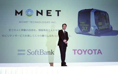 Softbank Group Corp. Chairman Masayoshi Son, left, and Akio Toyoda, right, President of Toyota Motor Corporation shank hands during a press conference in Tokyo Thursday, Oct. 4, 2018. Image credit: AP Photo/Eugene Hoshiko