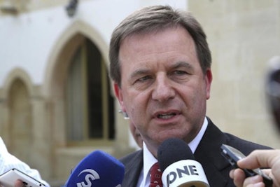 ExxonMobil Senior Vice President Neil Chapman speaks to the media after a meeting with Cyprus' president Nicos Anastasiades at the presidential palace in capital Nicosia, Cyprus, Friday Oct. 5, 2018. Chapman says the energy company will go ahead with a search for natural gas off the cost of Cyprus by the end of the year. (AP Photo/Petros Karadjias)