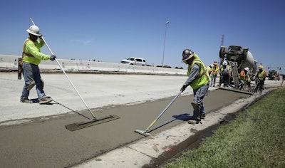 In this July 11, 2018, file photo, workers repave a street in Roseville, Calif., partially funded by a gas tax hike passed by the Legislature in 2017. Image credit: