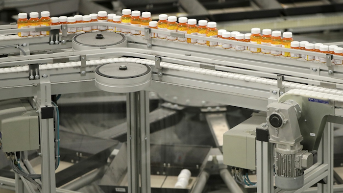 In this July 10, 2018, file photo bottles of medicine ride on a belt at the Express Scripts mail-in pharmacy warehouse in Florence, N.J. Image credit: AP Photo/Julio Cortez, File