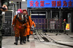 In this photo taken Oct. 21, 2018 and released by Xinhua News Agency, rescuers walk out of the site of a coal mine where falling rocks killed miners and trapped some in Yuncheng County in eastern China's Shandong Province. Image credit: Guo Xulei/Xinhua via AP
