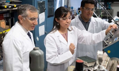 Rice University chemist James Tour, left, graduate student Gladys López-Silva and postdoctoral researcher Rodrigo Salvatierra use a film of carbon nanotubes to prevent dendrite growth in lithium metal batteries, which charge faster and hold more power than current lithium-ion batteries. (Jeff Filtow/Rice University)