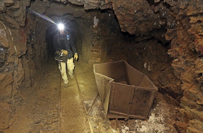 In this Aug. 14, 2018, photo, Jeremy MacLee walks through a mine near Eureka, Utah. Image credit: AP Photo/Rick Bowmer