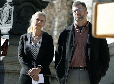 In this Feb. 19, 2015 file photo Hope, left, and Mike Reilly of Pueblo, Colo., attend a news conference in reaction to the announcement that a federal lawsuit is being filed on behalf of the couple by a Washington D.C.-based group to shut down the state's $800-million-a-year marijuana industry, in Denver. Image credit: AP Photo/David Zalubowski, File