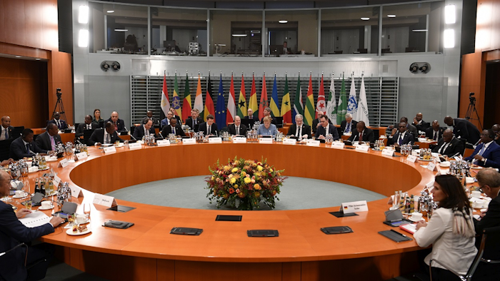 German Chancellor Angela Merkel, center, opens a meeting as part of the 'G20 Compact with Africa Conference' at the chancellery in Berlin, Germany, Tuesday, Oct. 30, 2018. Image credit: John MacDougall, Pool via AP