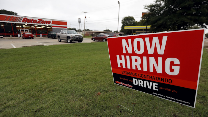 In this Sept. 27, 2018, file photo a bilingual help wanted sign for Auto Zone is posted outside the store in Canton, Miss. Image credit: AP Photo/Rogelio V. Solis, File