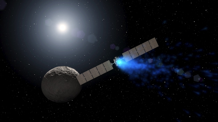 This illustration made available by NASA depicts the Dawn spacecraft orbiting the dwarf planet Ceres. Image credit: NASA via AP