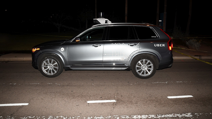 This file photo provided by the Tempe Police Department shows an Uber SUV after hitting a woman on March 18, 2018, in Tempe, Ariz. Image credit: Tempe Police Department via AP, File