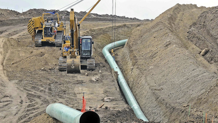 In this Oct. 5, 2016, file photo, heavy equipment is seen at a site where sections of the Dakota Access pipeline were being buried near the town of St. Anthony in Morton County, N.D. Image credit: Tom Stromme/The Bismarck Tribune via AP, File