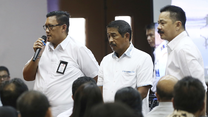Director of Safety and Security of Lion Air, Daniel Putut Kuncoro Adi, left, talks to relatives of the victims of the crashed Lion Air jet as President Director Edward Sirait, center, and founder and owner of the airline Rusdi Kirana, right, listen during a press conference in Jakarta, Indonesia, Monday, Nov. 5, 2018. Image credit: AP Photo/Achmad Ibrahim