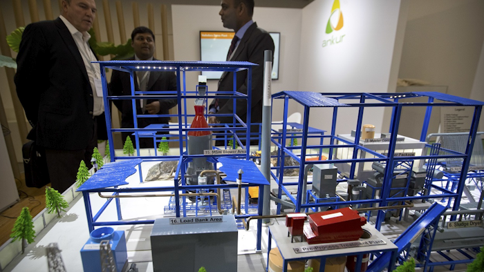 Visitors look at a display of a self-contained sewage treatment facility the Reinvented Toilet Expo in Beijing, Tuesday, Nov. 6, 2018. Image credit: AP Photo/Mark Schiefelbein