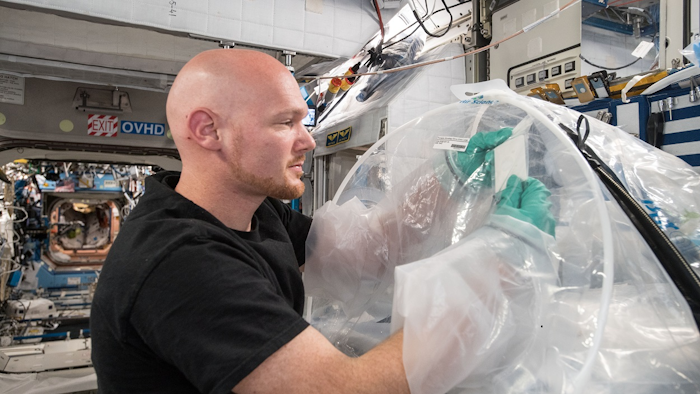 ESA astronaut Alexander Gerst works on earlier research on the cement hardening process in space. Image credit: NASA