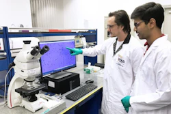 Researchers from the NUS Centre for Advanced 2D Materials examining the quality of graphene samples. Credit: NUS