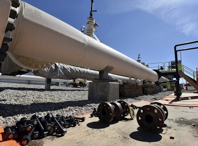 In this June 8, 2017, file photo, fresh nuts, bolts and fittings are ready to be added to the east leg of the pipeline near St. Ignace, Mich., as Enbridge prepares to test the east and west sides of the Line 5 pipeline under the Straits of Mackinac in Mackinaw City, Mich. Image credit: Dale G Young/Detroit News via AP, File