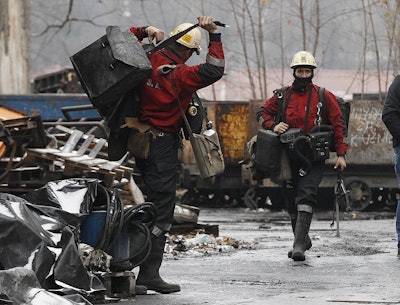In this Nov. 21, 2018 photo a mining rescue team arrive for their regular shift at the Wujek coal mine in Katowice, in Poland's southern mining region of Silesia. Image credit: AP Photo/Czarek Sokolowski