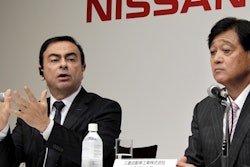 In this this Dec. 14, 2010 file photo, then Nissan Motor Co. President and CEO Carlos Ghosn, left, speaks as then Mitsubishi Motors Corp. President Osamu Masuko looks on during their joint press conference in Tokyo. Image credit: AP Photo/Koji Sasahara, File