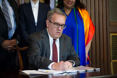 Acting EPA Administrator Andrew Wheeler signs an order withdrawing an Obama era emissions standards policy, at the EPA Headquarters in Washington, Thursday, Dec. 6, 2018. Image credit: AP Photo/Cliff Owen