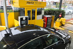 In this Friday, Dec. 7, 2018, photo, a Hertz 'Fast Lane' sign directs rental car drivers to a biometric scanning machine at Hartsfield-Jackson Atlanta International Airport, in Atlanta. Image credit: AP Photo/Jeff Martin